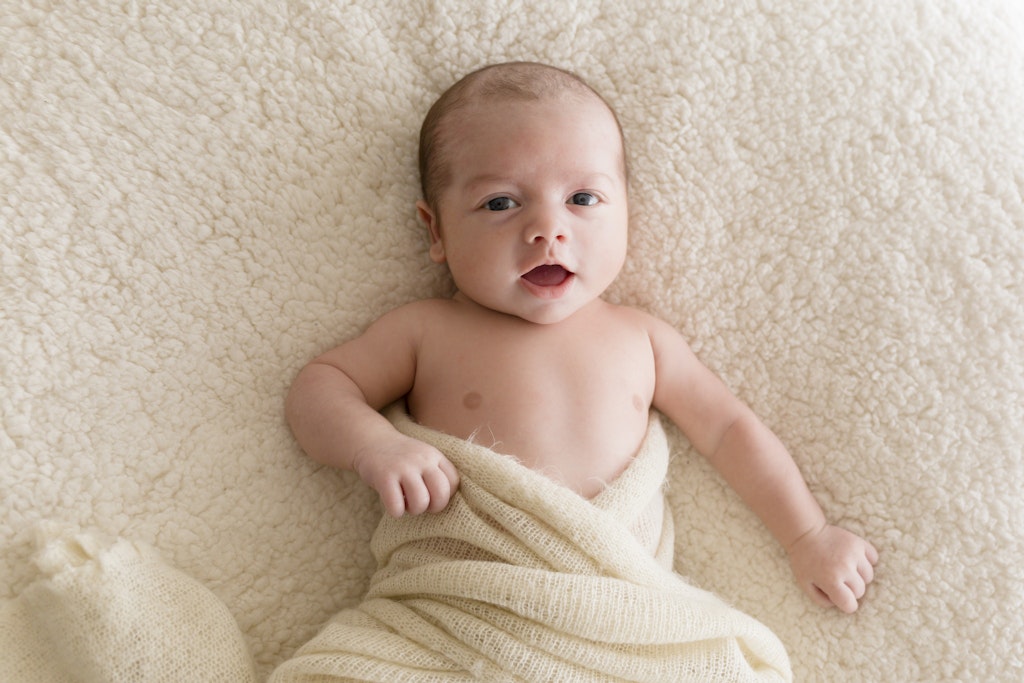 Chayse-3 - Jude Conning Photography | Taree newborn photography | Happy baby on a bed looking natural