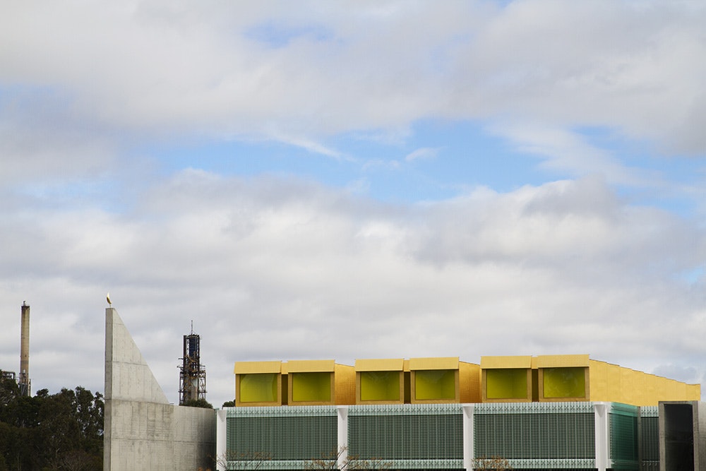 Rooftop with Oil Refinery in Background